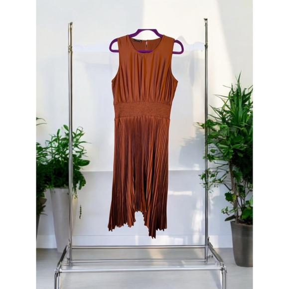 Express Dresses & Skirts - ￼L Express burnt orange, rust, satin sleeveless,pleated skirt asymmetric hemline